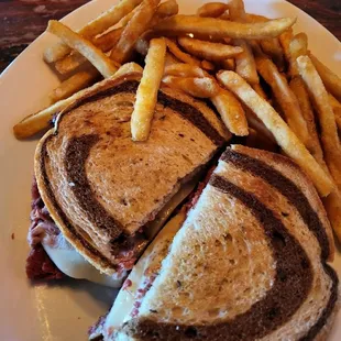 Grilled reuben sandwich and  fries