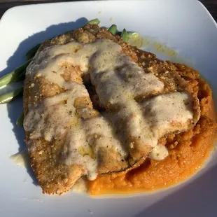 Walnut crusted trout served over mashed sweet potatoes and with green beans