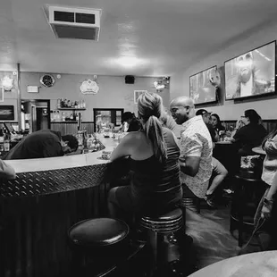 people sitting at the bar