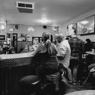 people sitting at the bar