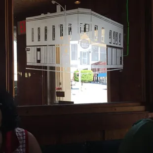 the reflection of a building in a window