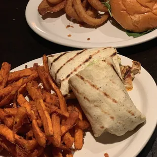 Yummy spicy chicken wrap with sweet potato fries and the lamb burger with onion rings