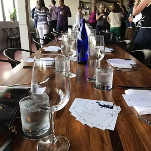 a long table with wine glasses on it