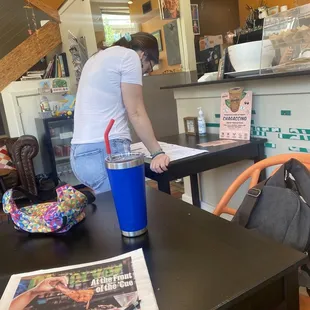 a woman standing at the counter