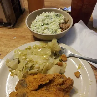 a plate of fried chicken, coleslaw, and coleslaw