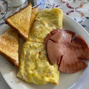 Ham, cheese and onion omelette with fried bologna and toast