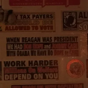 Bumper sticker on the refrigerator.