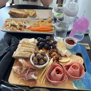 Hummus plate with veggies chauerterie board great cheeses, jam, meats, etc.