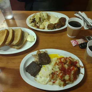Both our meals- scrapple eggs and browns,. Sausage, eggs and browns. Toast for two!