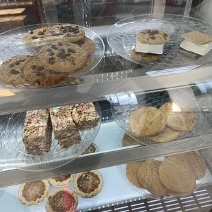 a display of cookies and pies