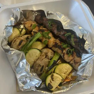 Beef skewer, chicken skewer, two mixed veggie skewers