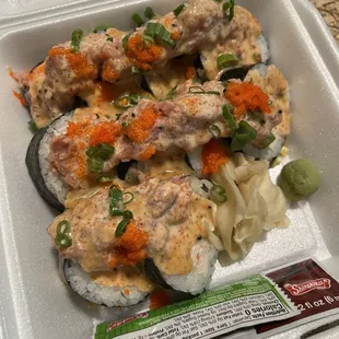 a close up of a meal in a styrofoam container