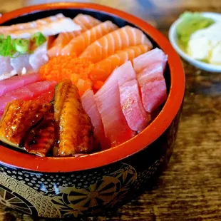 Chirashi Bowl: assorted sashimi over rice (salmon, tuna, yellow tail, albacore, broiled eel, scallop, shrimp, flying fish roe) ($18.75).