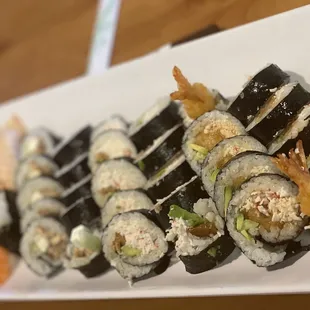 a plate of sushi rolls