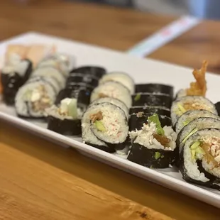 a plate of sushi rolls
