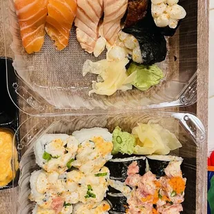 a variety of sushi in plastic containers