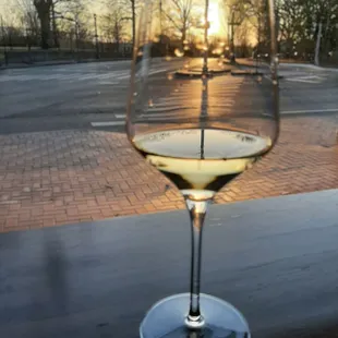 a glass of wine on a table