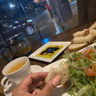Bread and oil, seasonal salad, and turmeric ginger tea
