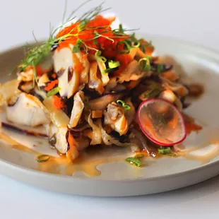 squid salad- cold marinated squid, chili oil, masago, sesame seeds, and scallions.