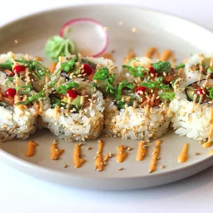 spicy tuna roll- NORI- spicy tuna - avocado - jalapeños - spicy mayo - sesame seeds.