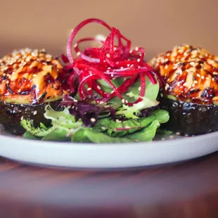 birds nest- stuffed baked avocado with out special crab mix. Served with spicy mayo, unagi, sauce, and sesame seeds.