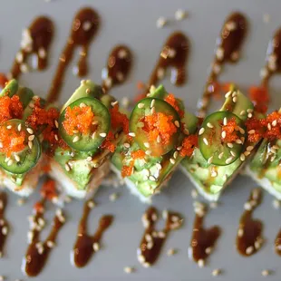buddha roll- NORI - tempura shrimp - crab mix - jalapeños - cream cheese - spicy tuna - avocado - unagi sauce - masago - sesame seeds.