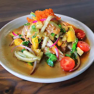 ceviche- diced fish with yuzu, fresh herbs, mango, cucumbers, and masago.