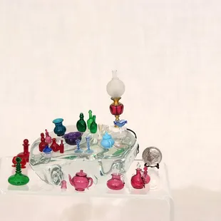 Miniature handblown glassware, most no bigger than a dime