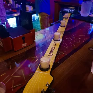 a guitar neck on a bar