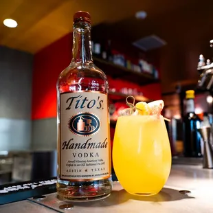 a cocktail and a bottle