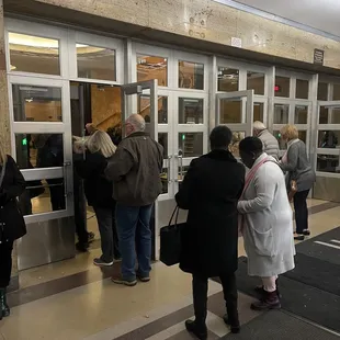 a group of people standing in line