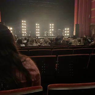 a view of the stage from the back of the auditorium