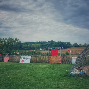 The apple orchard starts along the left side of the photo.