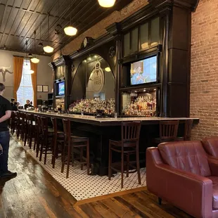 a man standing in front of the bar