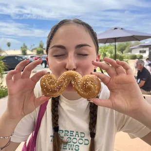 a girl with a fake mustache