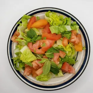 a salad with tomatoes and lettuce