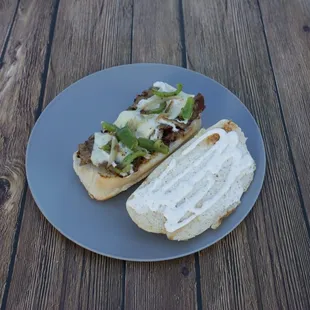 a half eaten sandwich on a plate