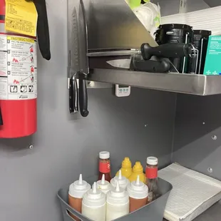 a shelf of condiments