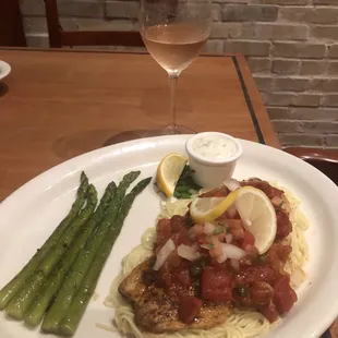 Veracruz style Red Snapper on a bed of pasta with your choice of side.