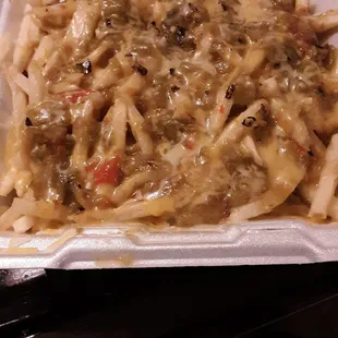 Green Chili cheese fries to-go. Toss an over-easy egg on top and YUMMM!