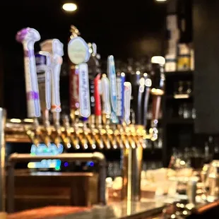 a row of beer taps