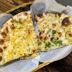 two slices of pizza in a basket