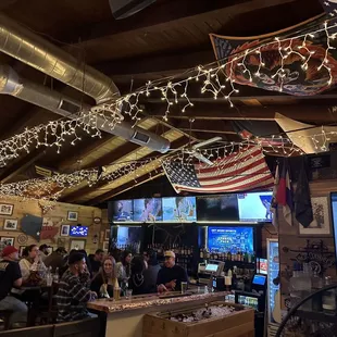 a large group of people sitting at a bar