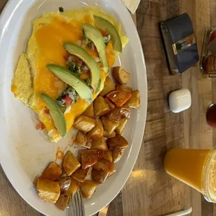 Avocado omelette with home made potatoes.