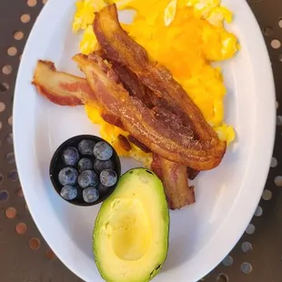 keto plate with scrambled eggs. blueberries and 1/2 avacado