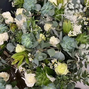 Shauna work directly with another vendor to secure floral elements within our event.