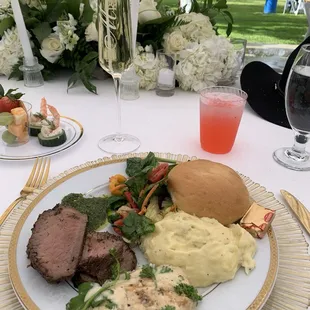 Tri tip with chimmi-churri sauce, creamy garlic chicken, roasted garlic Yukon gold mashed potatoes, and garden salad.
