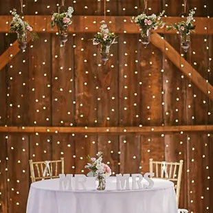 Sweetheart table inside the barn