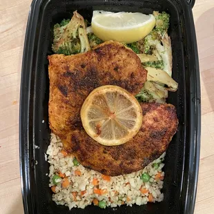 Lemon chicken w charred broccoli and cauliflower rice.