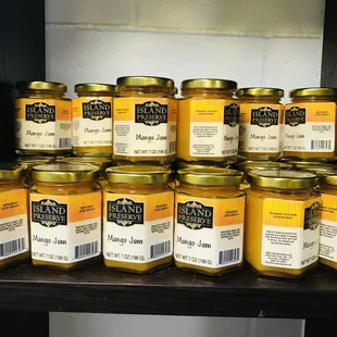a stack of jars of honey